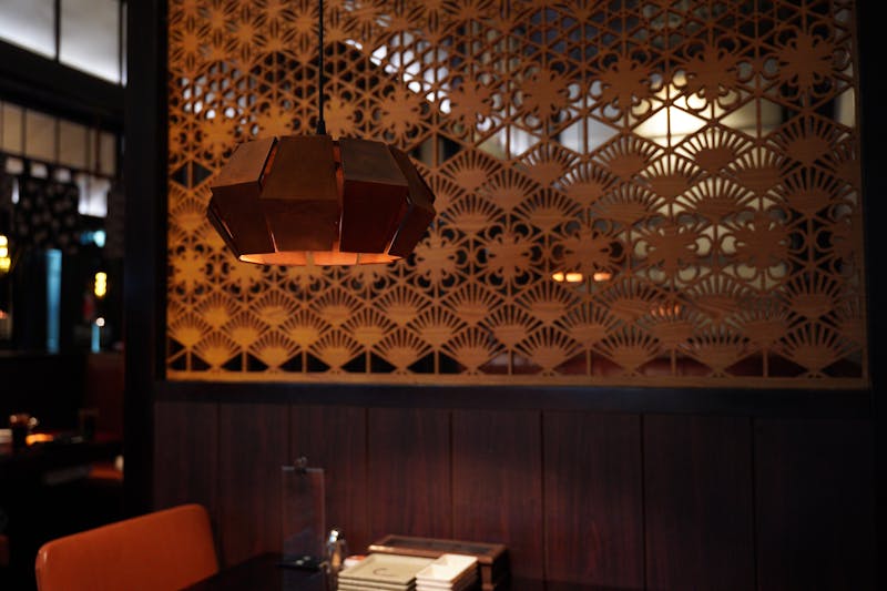 Pizzana restaurant interior with warm lighting and rustic decor